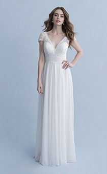 A woman wearing the Rapunzel wedding gown from the 2020 Disney Fairy Tale Weddings Collection