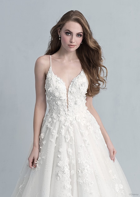 A front side view of a woman in the Snow White wedding gown from the 2021 Disney Fairy Tale Weddings Platinum Collection A front side view of a woman in the Snow White wedding gown from the 2021 Disney Fairy Tale Weddings Platinum Collection