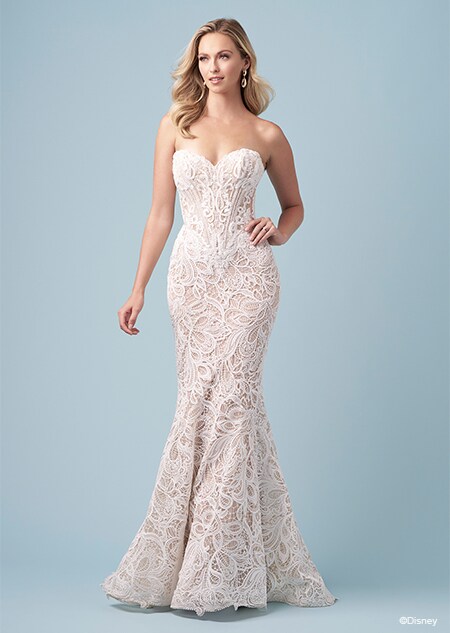 A bride wearing a strapless Jasmine inspired mermaid wedding gown featuring lace and a sweetheart neckline