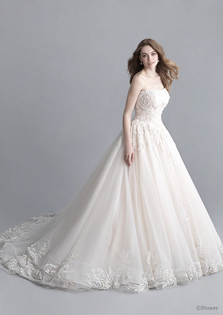 A woman wearing the Aurora wedding gown from the 2020 Disney Fairy Tale Weddings Platinum Collection