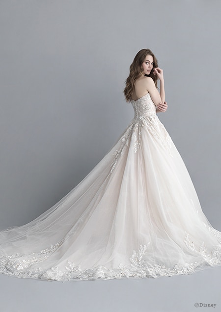 A back side view of a woman wearing the Ariel wedding gown from the 2020 Disney Fairy Tale Weddings Platinum Collection