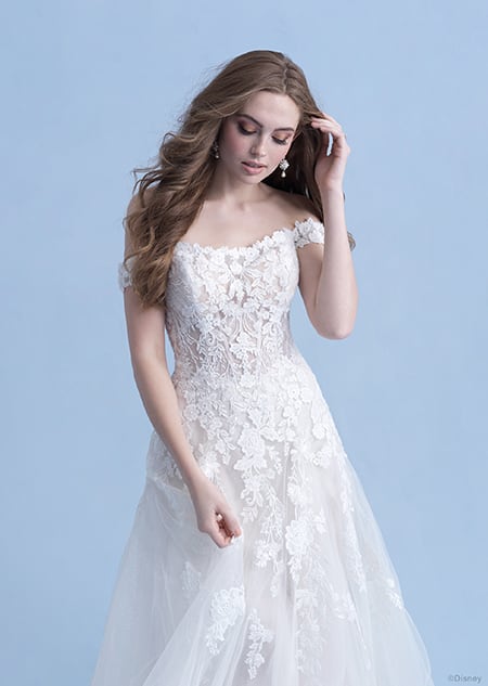 A side view of a woman in the Aurora wedding gown from the 2021 Disney Fairy Tale Weddings Collection