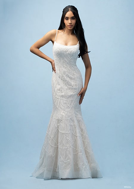 The front of a bride wearing a Tiana inspired sheath gown featuring beading, sequins and a spaghetti strap neckline