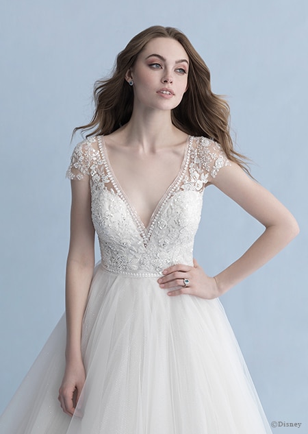 A woman in the Cinderella wedding gown from the 2020 Disney Fairy Tale Weddings Collection