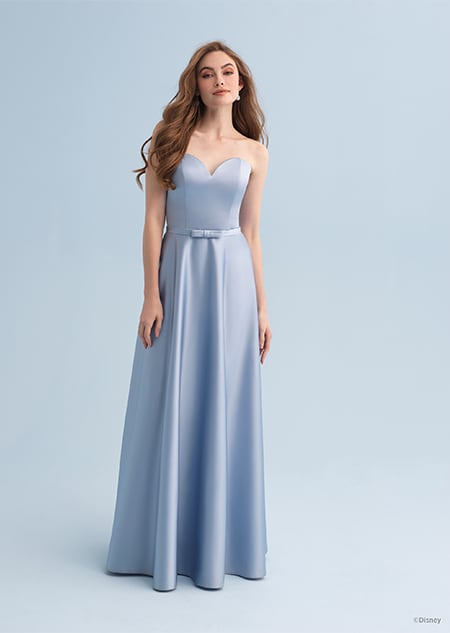 A woman wearing a Cinderella themed bridesmaid dress with a sweetheart neckline