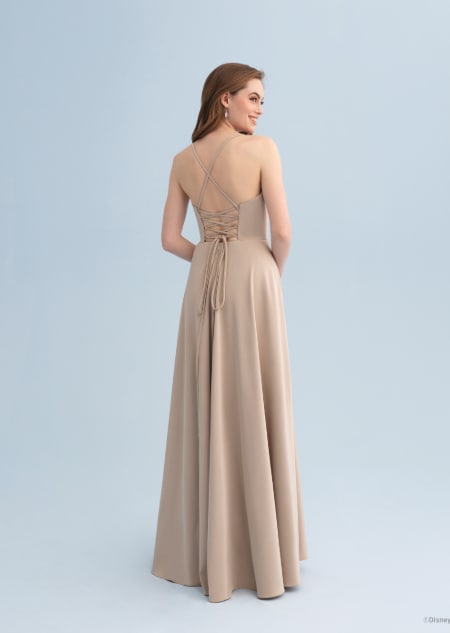 The back of a woman wearing a Belle themed bridesmaid dress with a lace up back
