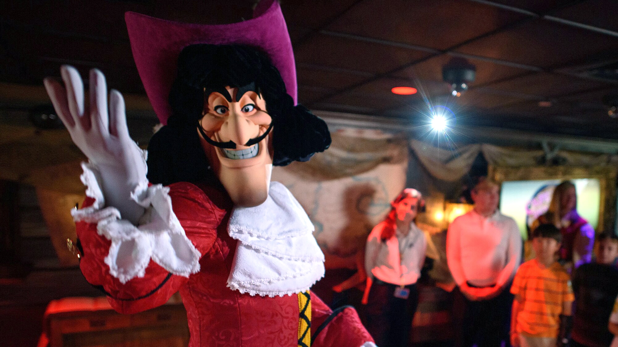 Captain Hook smiles with his fiendish grin as he welcomes children to his Pirate’s Crew event