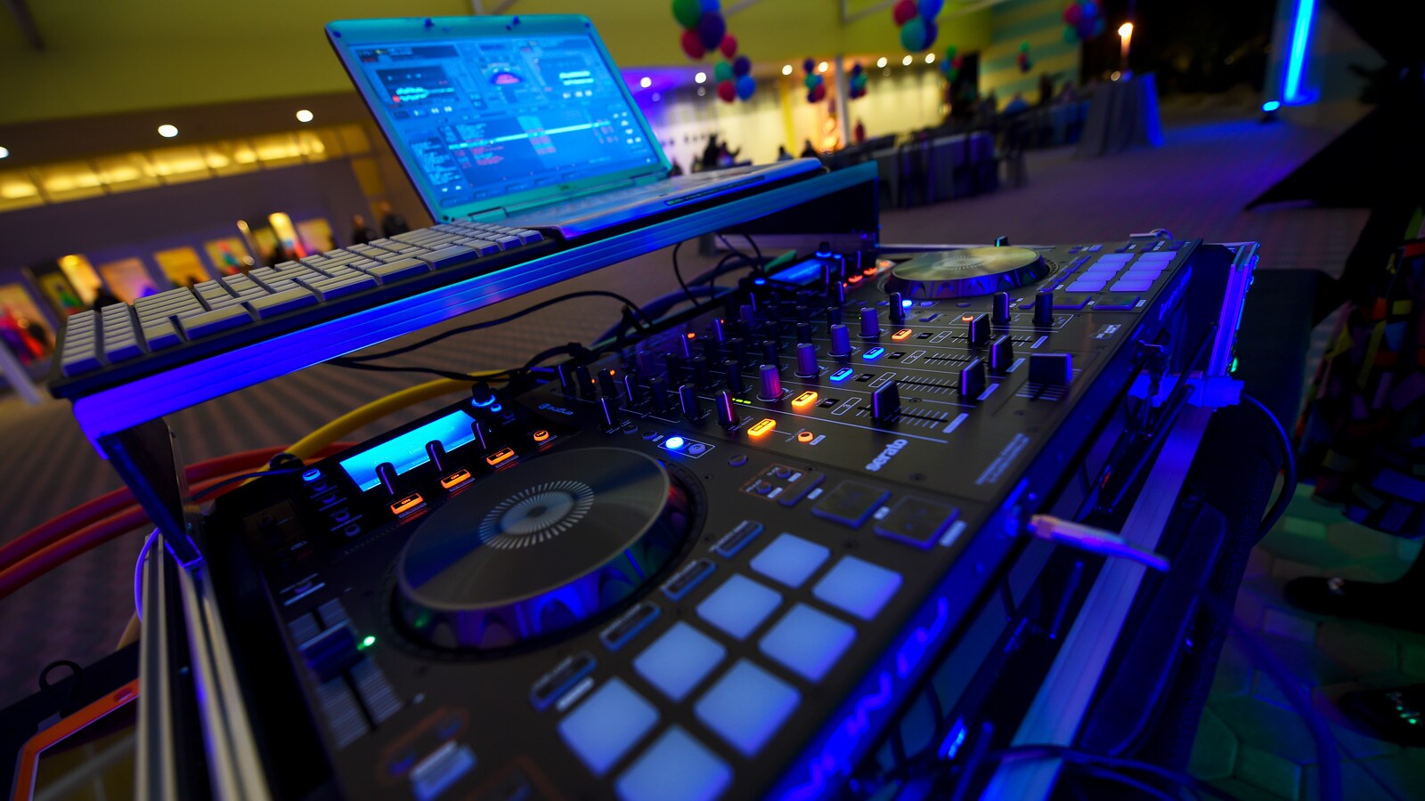 A DJ sound system set up in a banquet hall A DJ sound system set up in a banquet hall