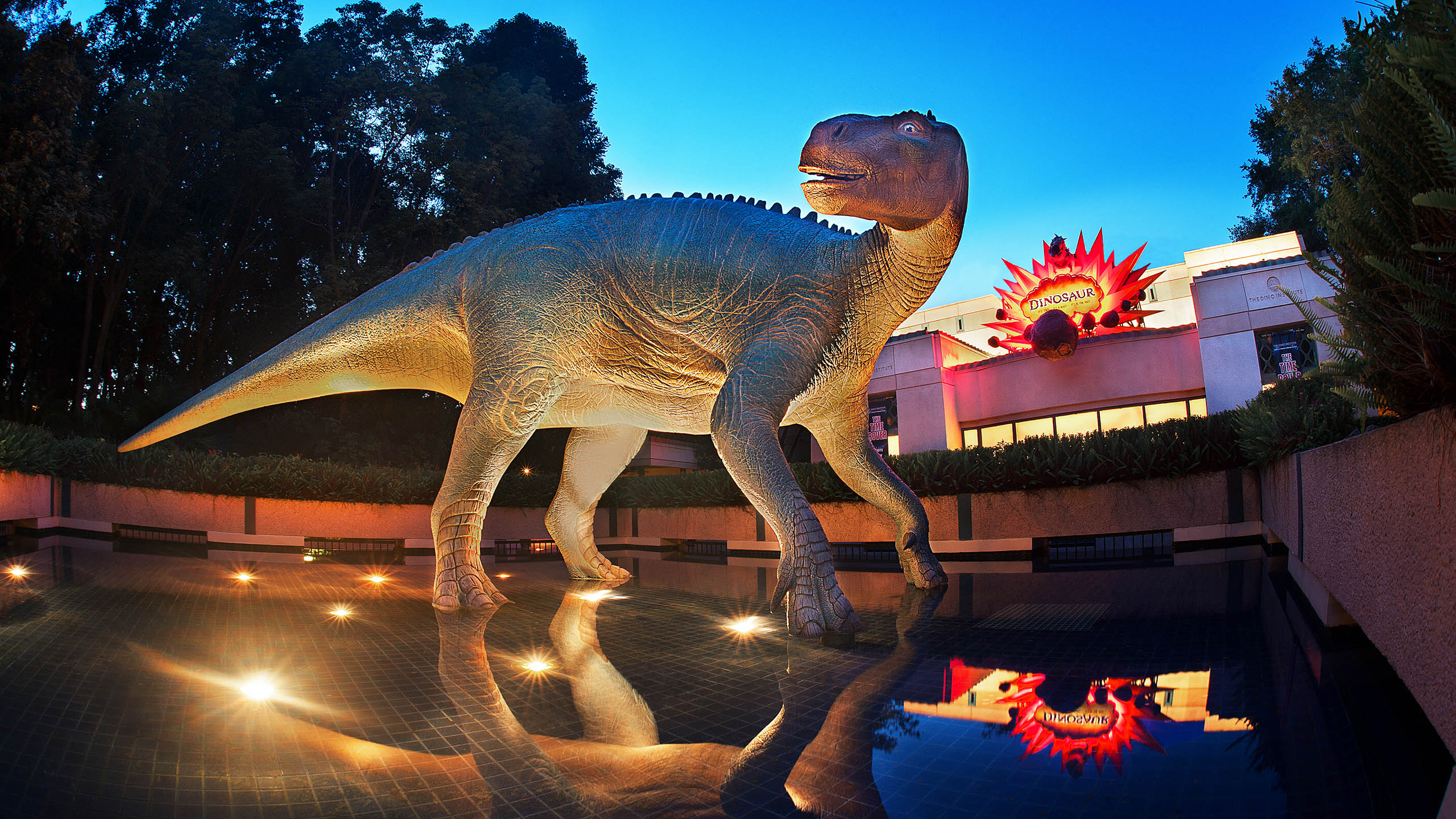 A large dinosaur figure at the entrance of the DINOSAUR attraction at Disney's Animal Kingdom park