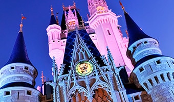 Magic Kingdom Park The spires of Cinderella Castle awash in 2 different colors at night