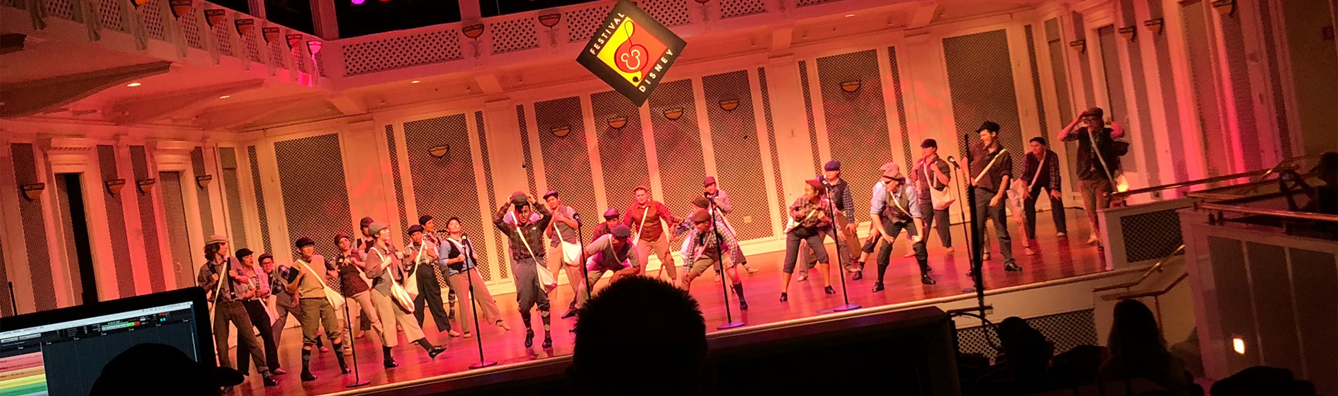 A group of Disney Imagination Campus students give a live performance on a stage